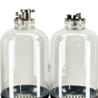Side-by-side comparison of two Apollo pressure fermenters with stainless and plastic lids installed