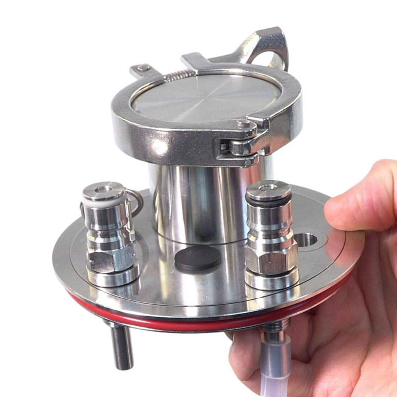 Universal Apollo Stainless Steel Pressure Lid with 2 inch Tri Clover Port shown in hand